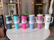 Set of colorful tumblers on a table with a blurred indoor background