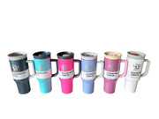 Set of colorful tumblers on a table with a blurred indoor background