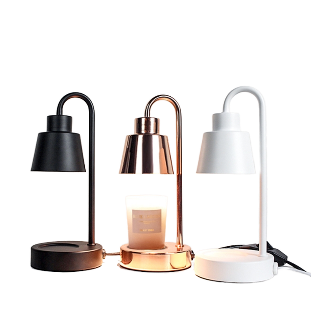 Three table lamps in black, gold, and white on a white background