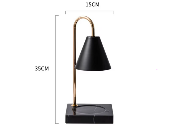 Black table lamp with gold accents and measurements on a white background