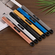 Five USB Candle lighters  in different colours on a wooden surface with a magazine and plant in the background.