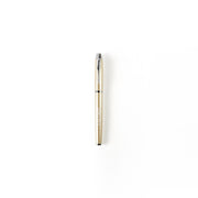 Gold pen on a white background