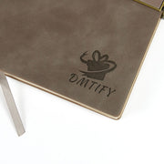 Brown notebook with 'DMTIFY' logo on a white background