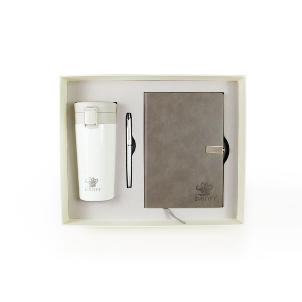 Set of white tumbler, gray notebook, and pen in a box with 'Dmtify' branding.