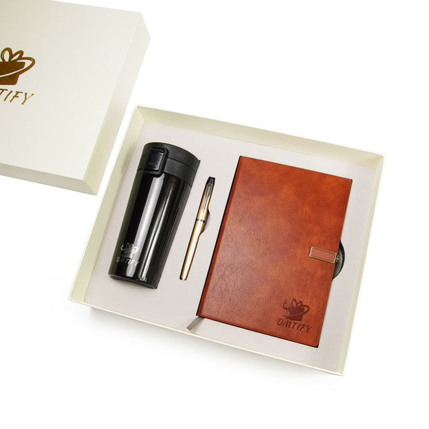 Gift set with brown leather notebook, black tumbler, and pen in a white box with 'Driify' branding.