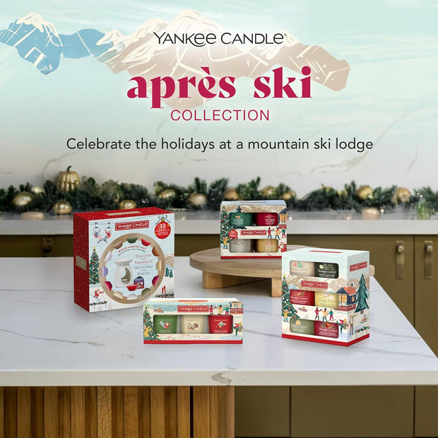 Yankee Candle après ski collection with candles and packaging on a kitchen counter.